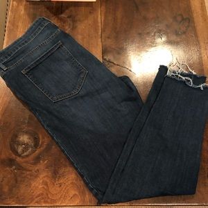 Women’s Just Black ankle length frayed hem jean.